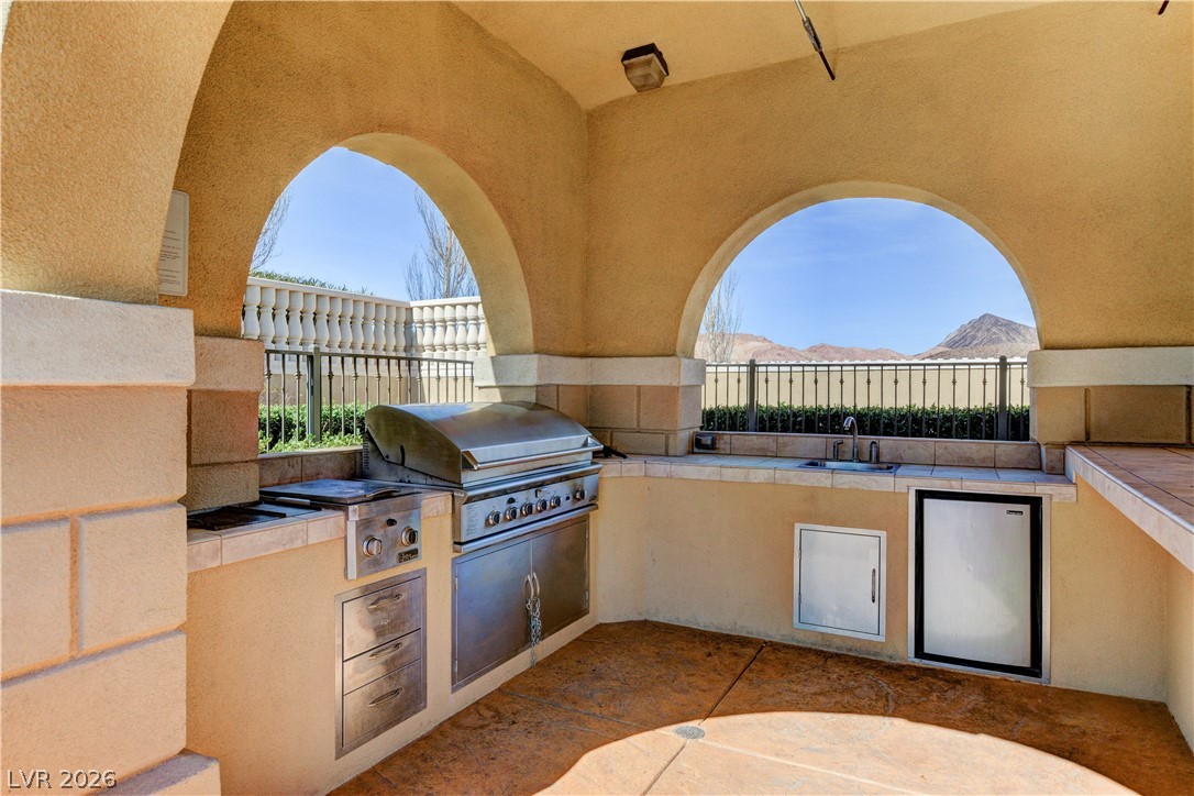 10 Strada Bella Vista, Unit 101 Henderson, NV 89011 - Photo 59 of 64 View of The V community, patio with exterior kitchen