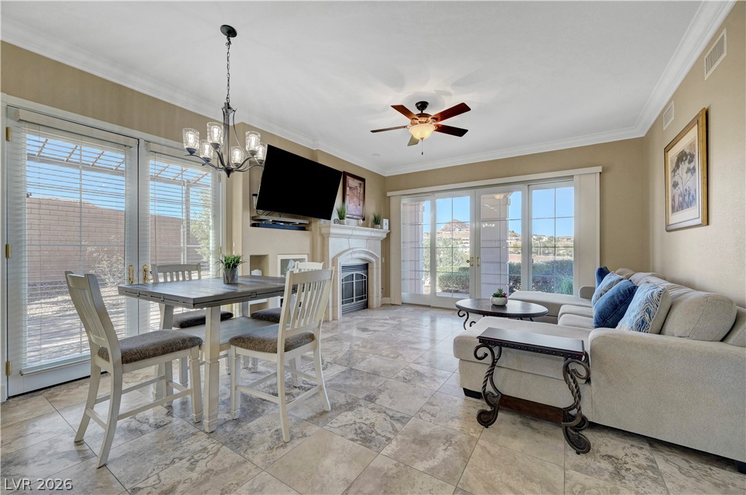 10 Strada Bella Vista, Unit 101 Henderson, NV 89011 - Photo 8 of 64 Dining space with a chandelier
