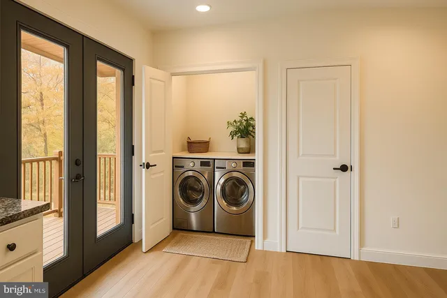 a view of a bedroom with washer and dryer