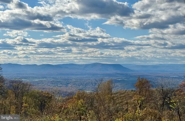 a view of lake with mountain in the back