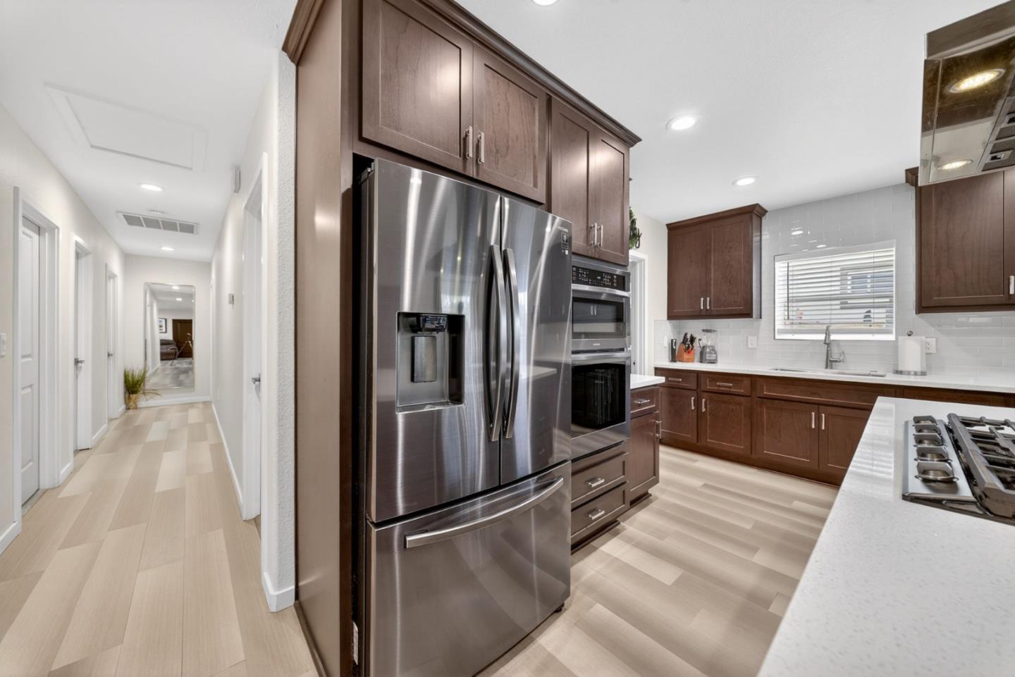 919 Old Canyon Road Fremont, CA 94536 - Photo 9 of 55 a large kitchen with stainless steel appliances granite countertop a refrigerator and a sink