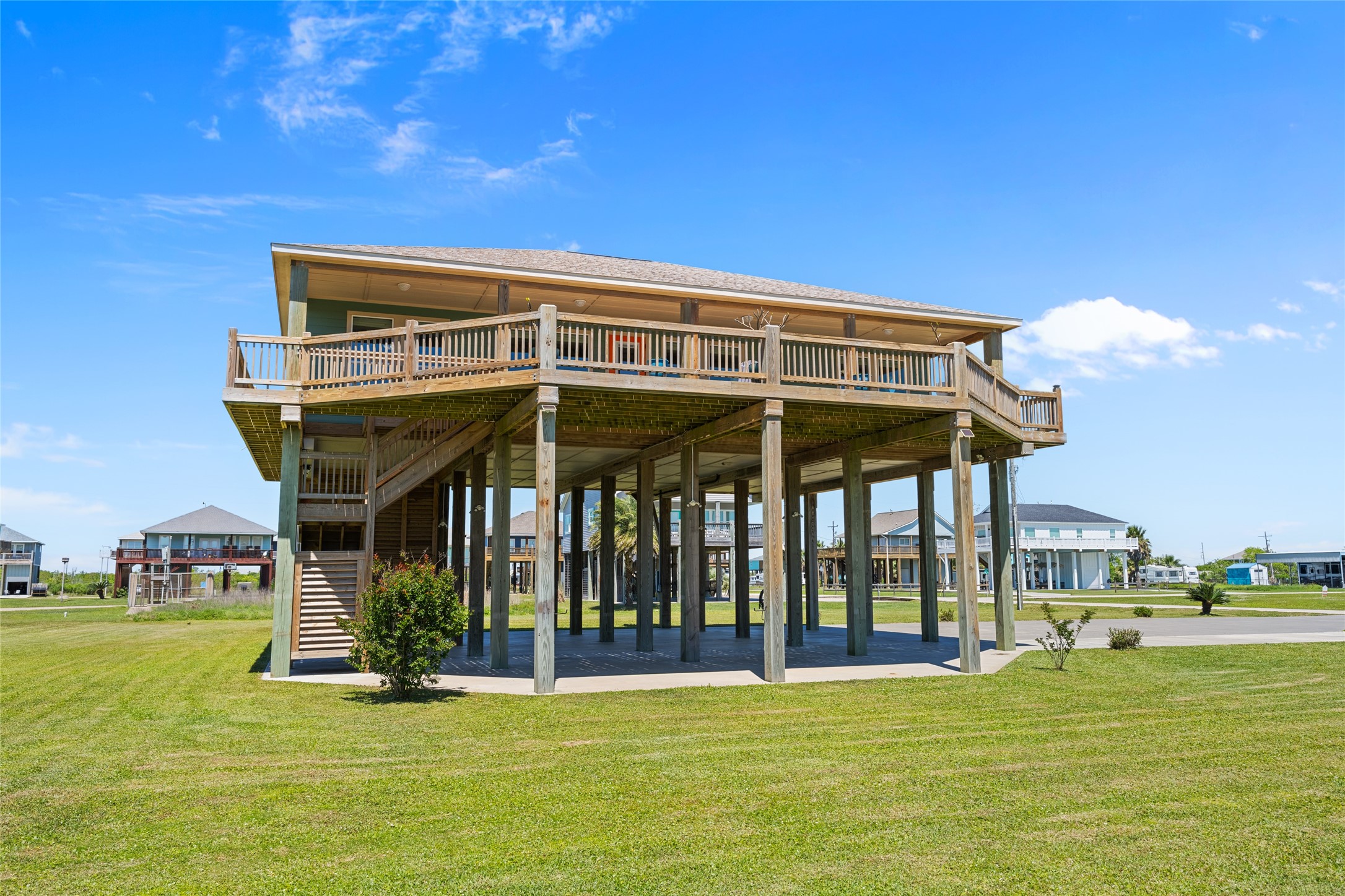 817 Boyt Road Crystal Beach, TX 77650 - Photo 12 of 49 a view of a building with a swimming pool