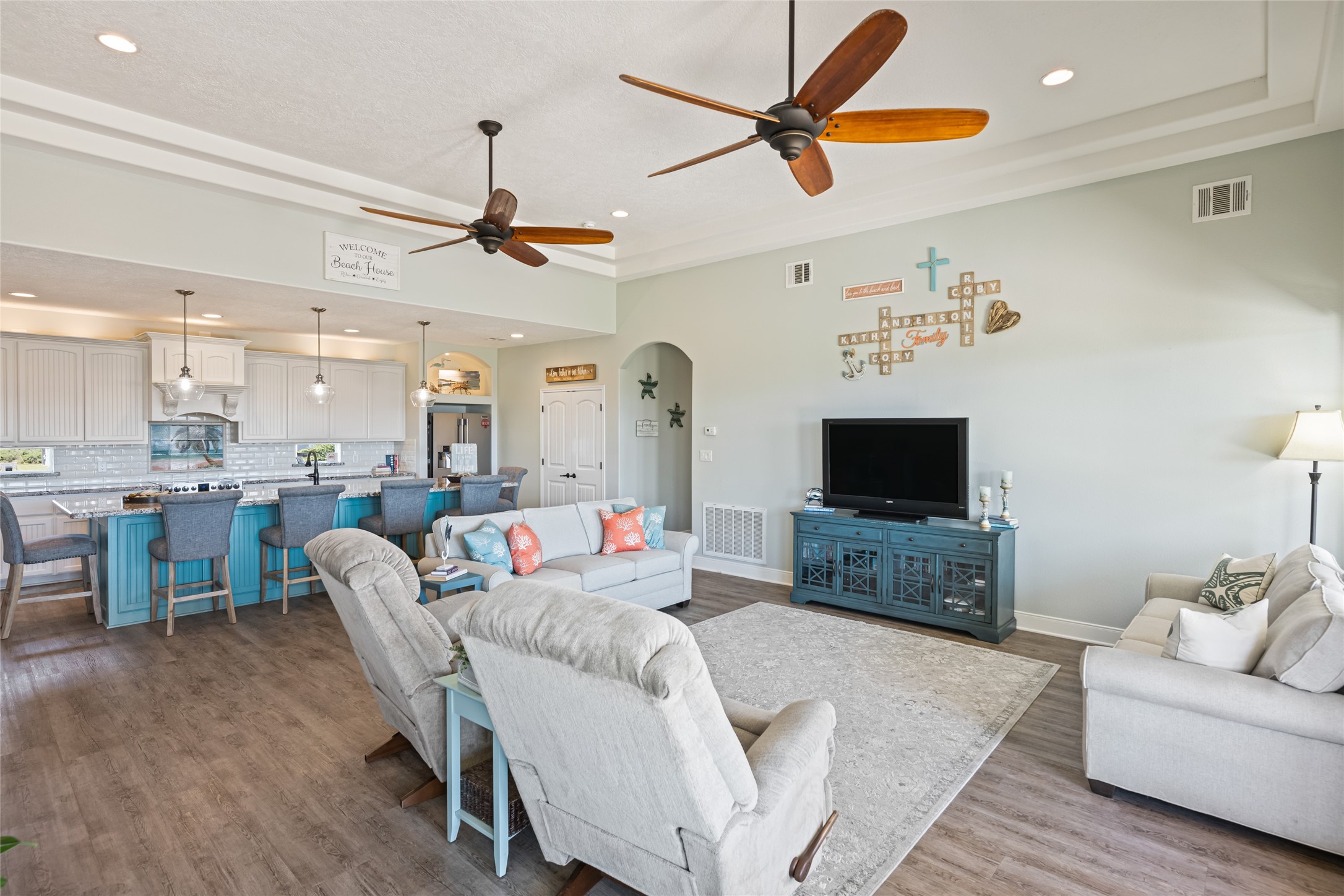 817 Boyt Road Crystal Beach, TX 77650 - Photo 16 of 49 a living room with furniture a flat screen tv and kitchen view