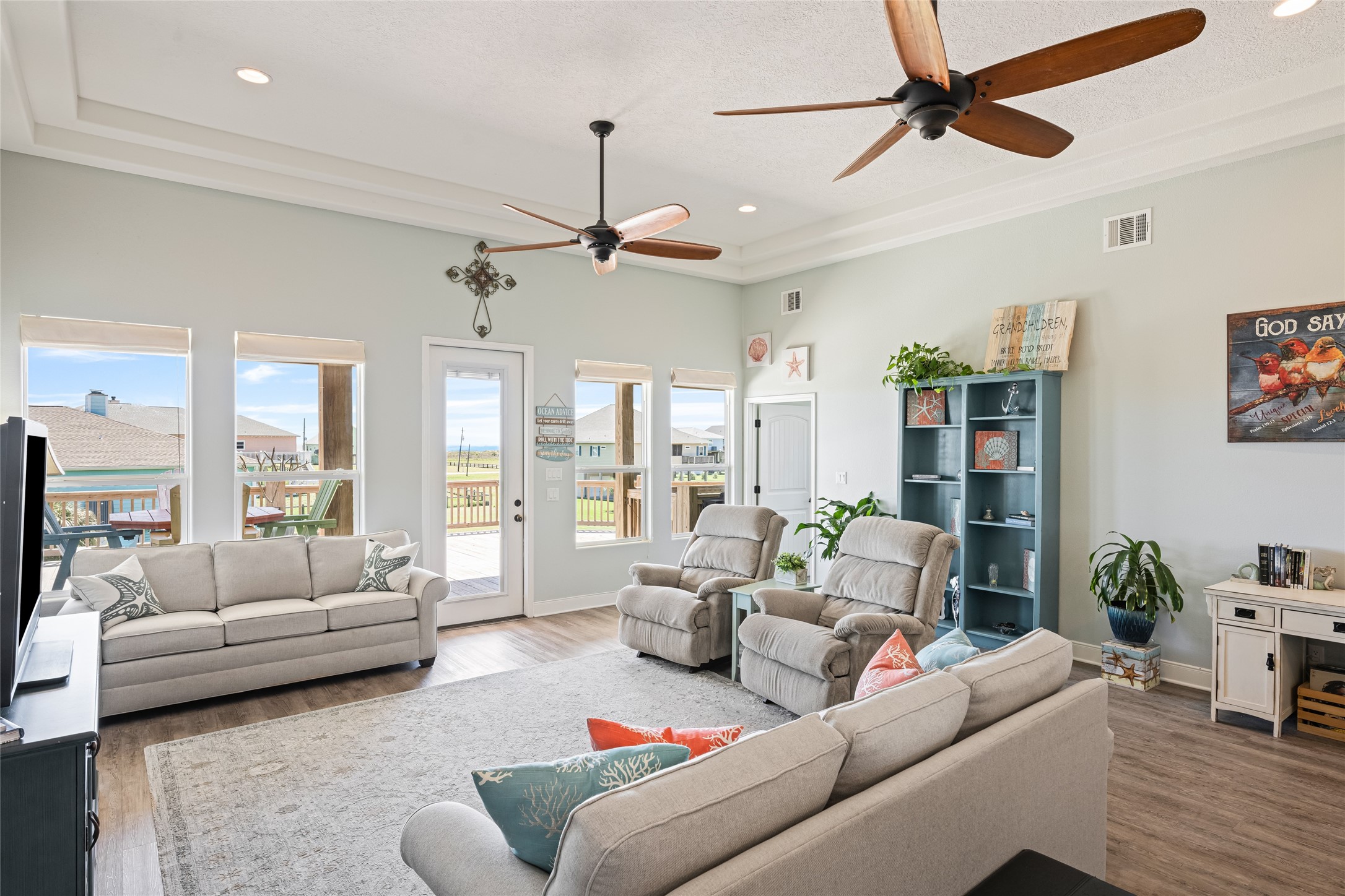 817 Boyt Road Crystal Beach, TX 77650 - Photo 19 of 49 a living room with furniture ceiling fan and a rug