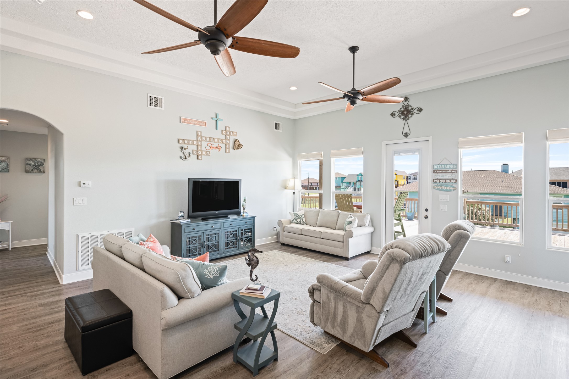 817 Boyt Road Crystal Beach, TX 77650 - Photo 20 of 49 a living room with furniture ceiling fan and a fireplace