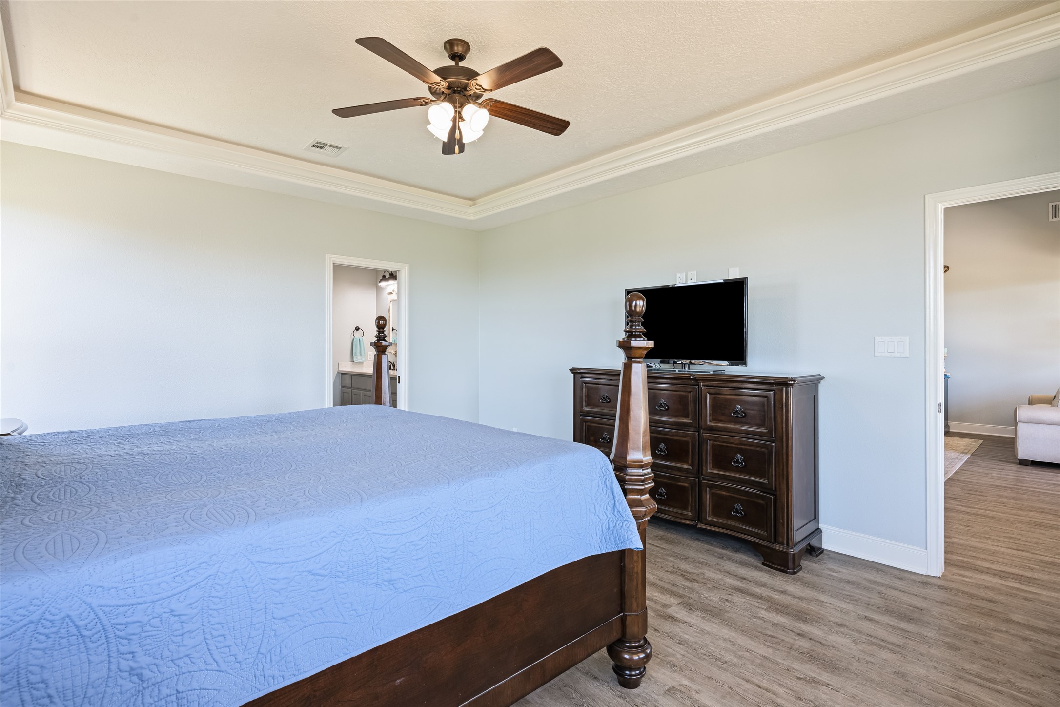 817 Boyt Road Crystal Beach, TX 77650 - Photo 29 of 49 a bedroom with a bed and a flat tv screen on dresser