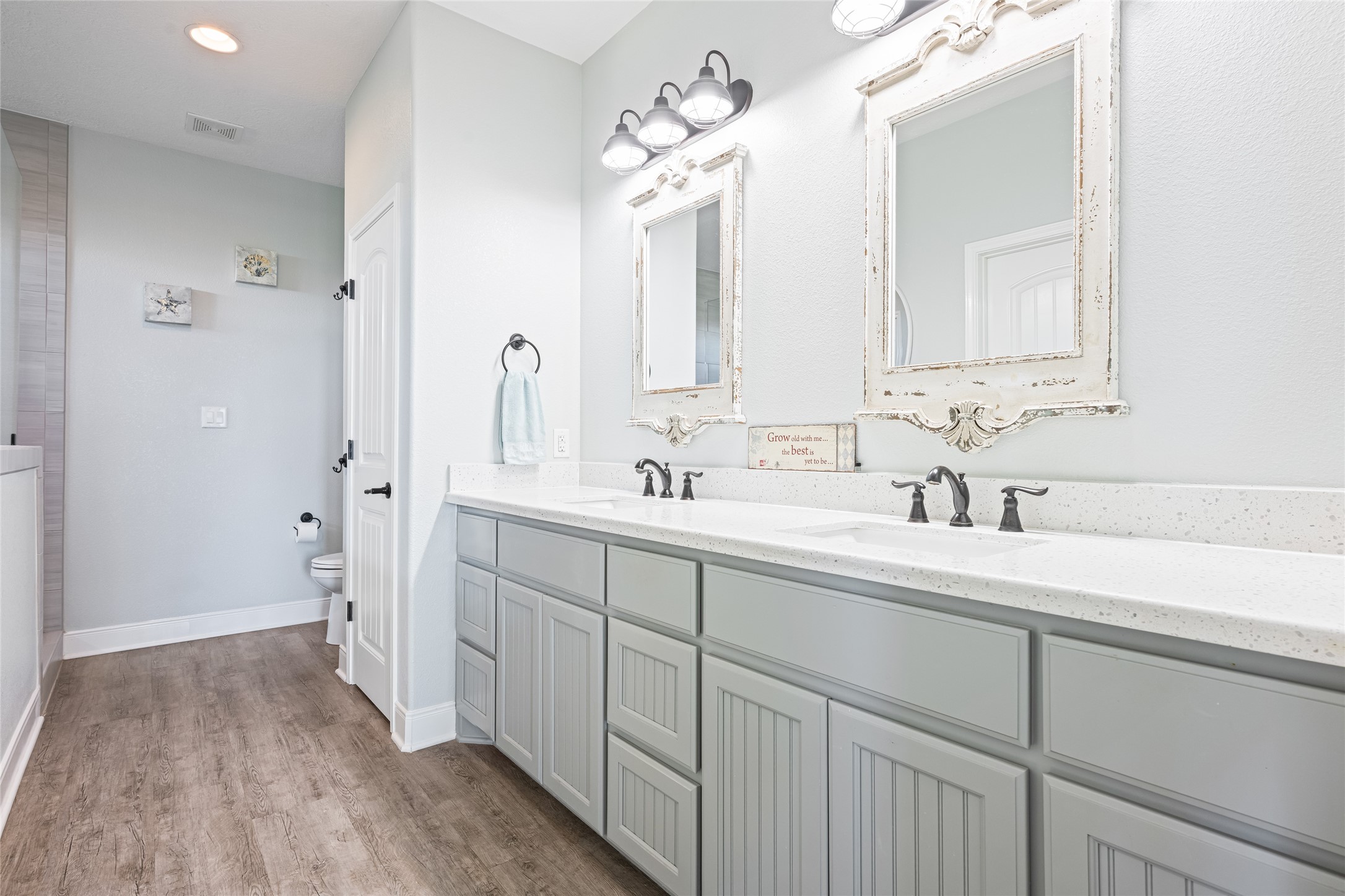 817 Boyt Road Crystal Beach, TX 77650 - Photo 30 of 49 a bathroom with a double vanity sink mirror and shower