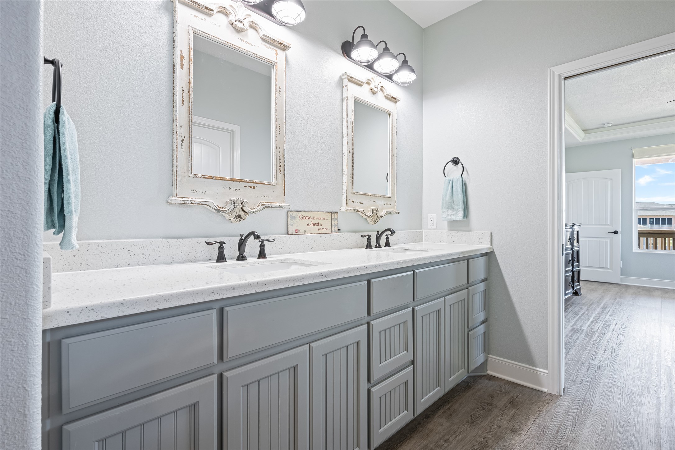 817 Boyt Road Crystal Beach, TX 77650 - Photo 31 of 49 a bathroom with a double vanity sink and a mirror