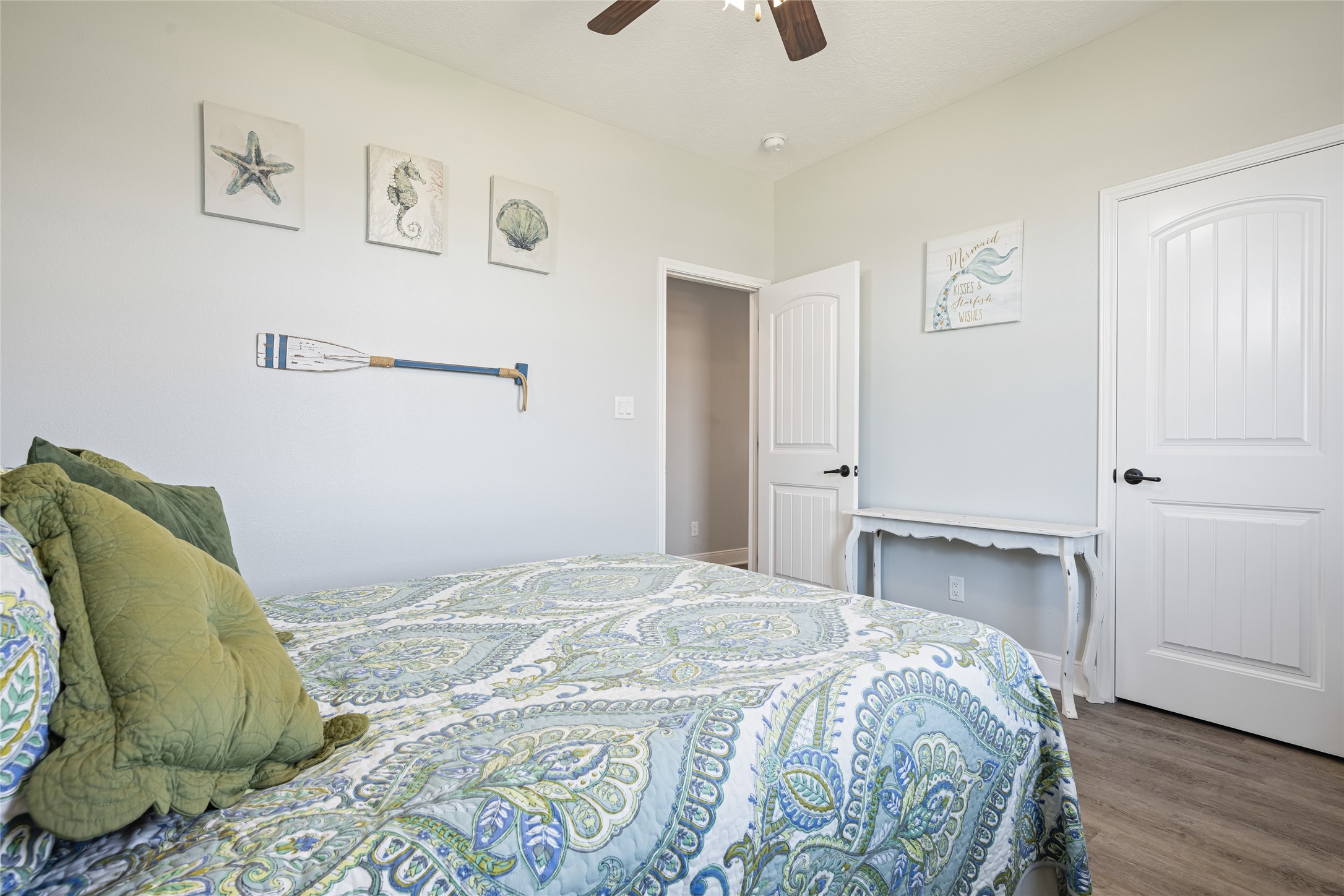 817 Boyt Road Crystal Beach, TX 77650 - Photo 35 of 49 a bedroom with a bed and painting on the wall