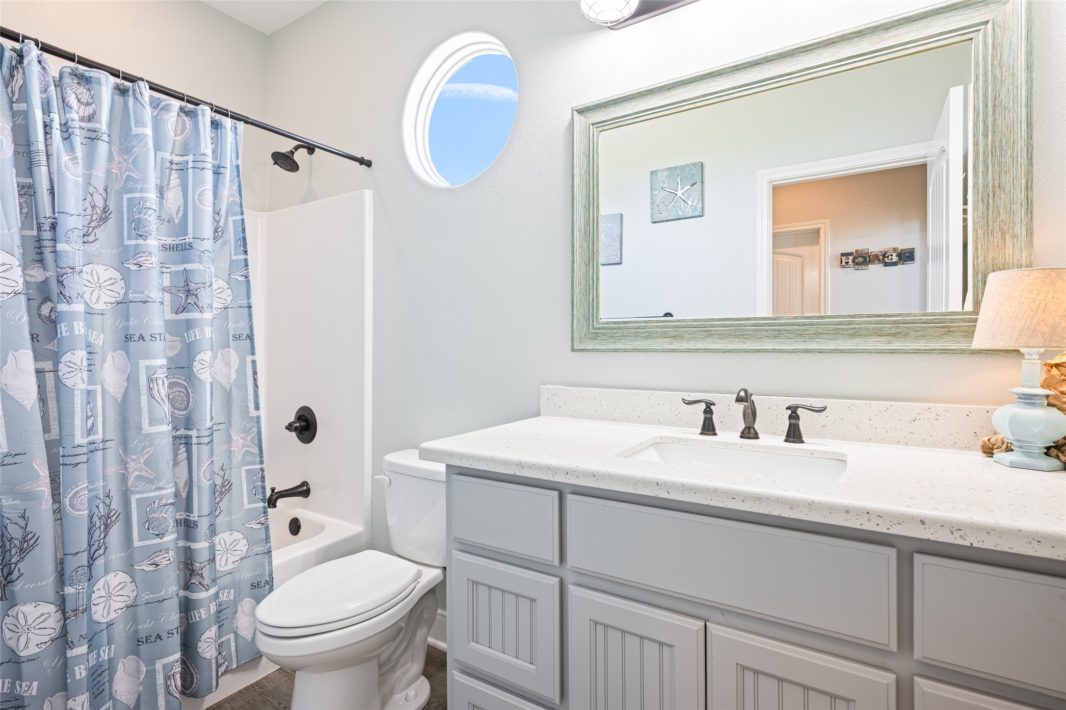 817 Boyt Road Crystal Beach, TX 77650 - Photo 36 of 49 a bathroom with a sink a toilet and a mirror