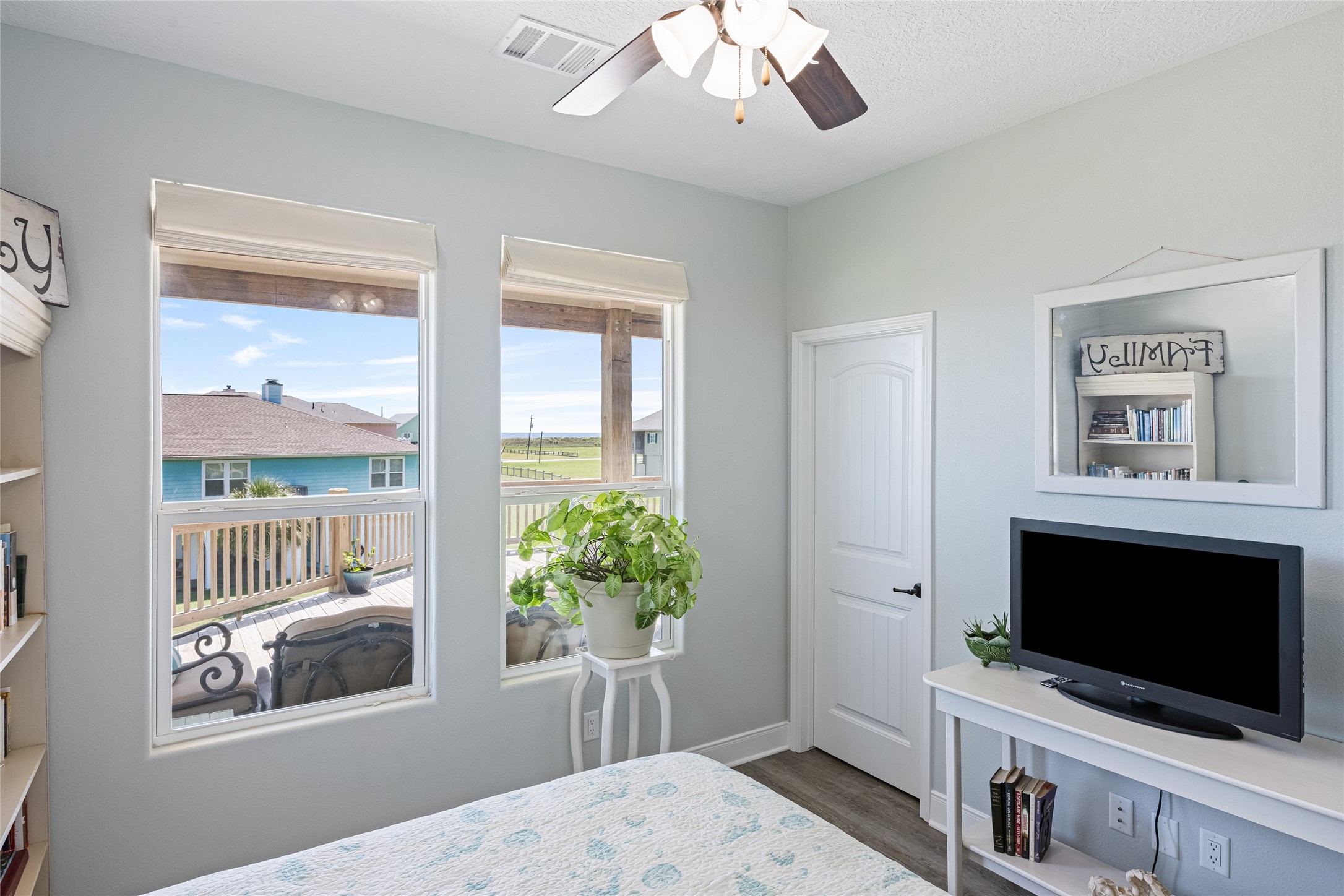 817 Boyt Road Crystal Beach, TX 77650 - Photo 38 of 49 a living room with furniture and a flat screen tv