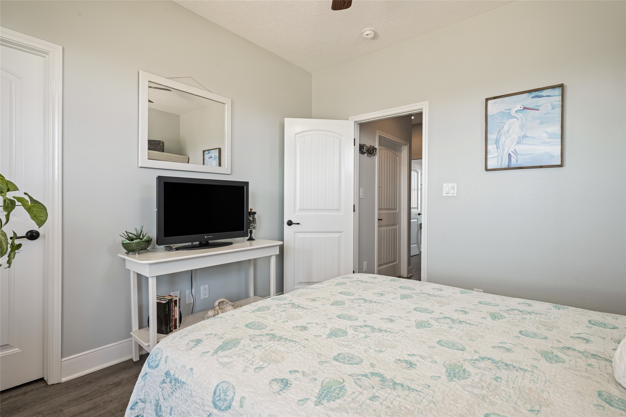 817 Boyt Road Crystal Beach, TX 77650 - Photo 39 of 49 a bedroom with a bed and a flat screen tv