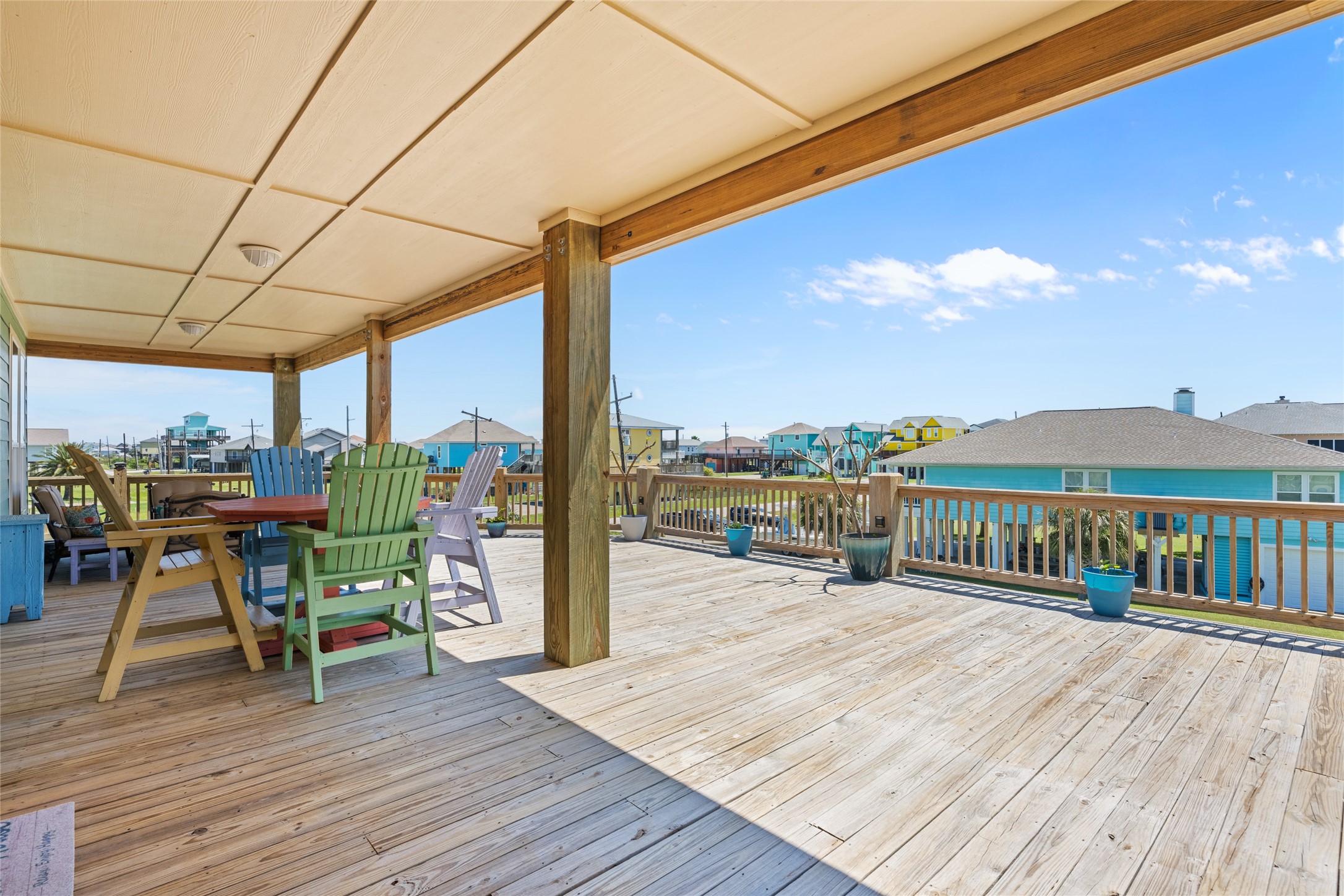 817 Boyt Road Crystal Beach, TX 77650 - Photo 42 of 49 a view of a balcony with chairs and wooden floor