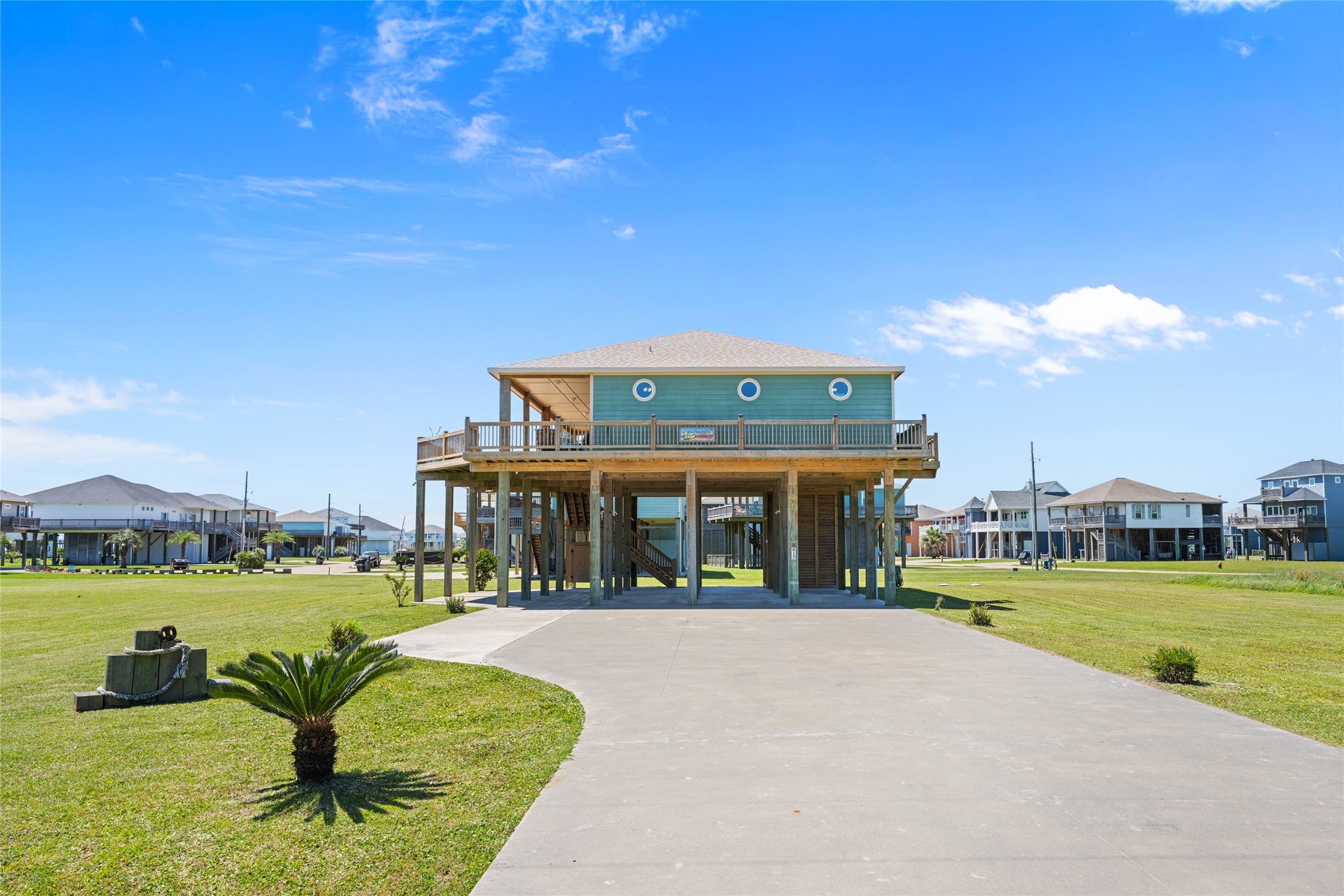 817 Boyt Road Crystal Beach, TX 77650 - Photo 43 of 49 a view of a building with a swimming pool