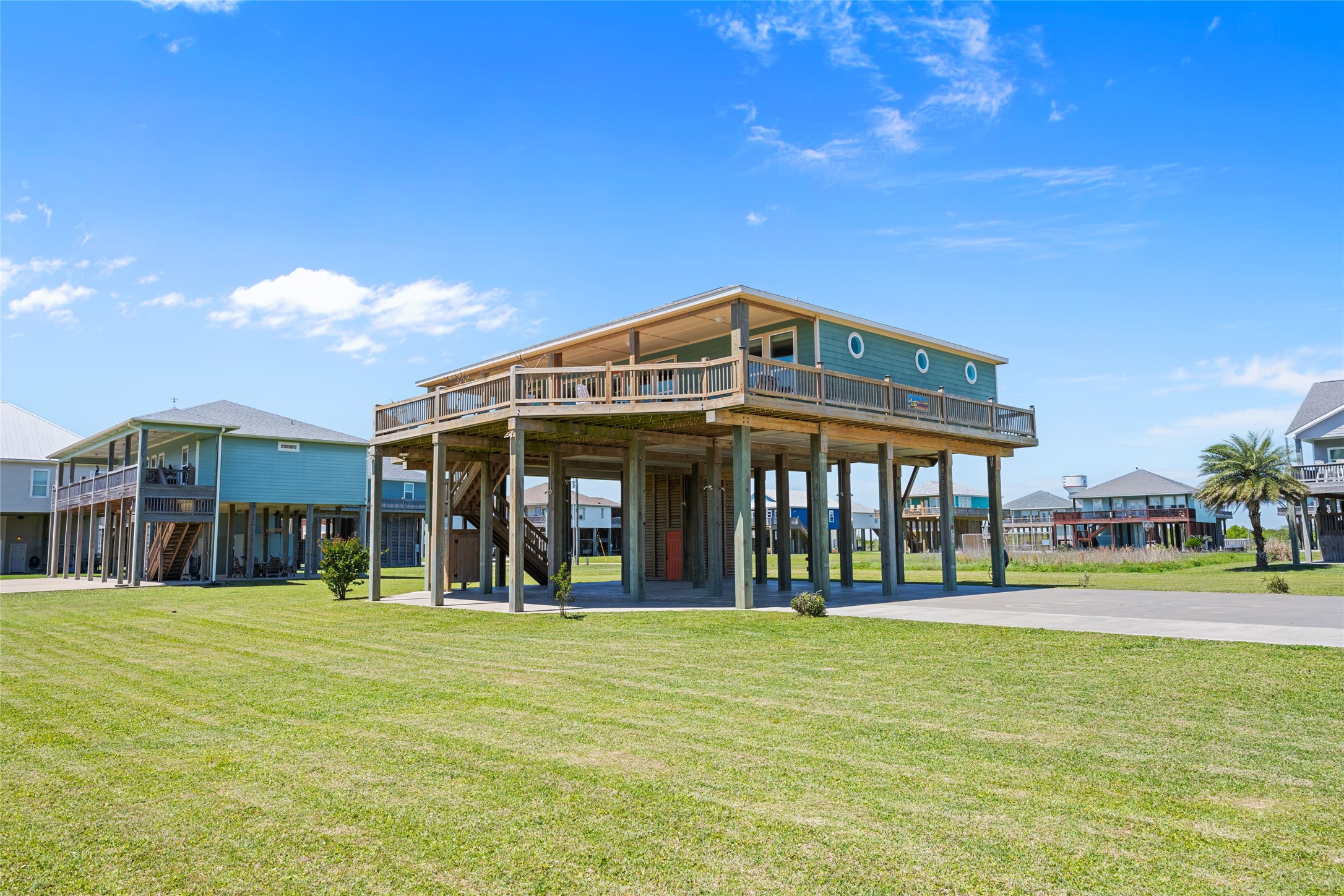 817 Boyt Road Crystal Beach, TX 77650 - Photo 10 of 49 a front view of a building with a yard