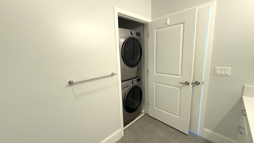 205 Maverick Street, Unit 412 Boston, MA 02128 - Photo 15 of 15 a utility room with dryer and washer
