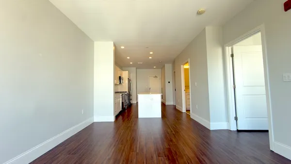 a hallway with wooden floor