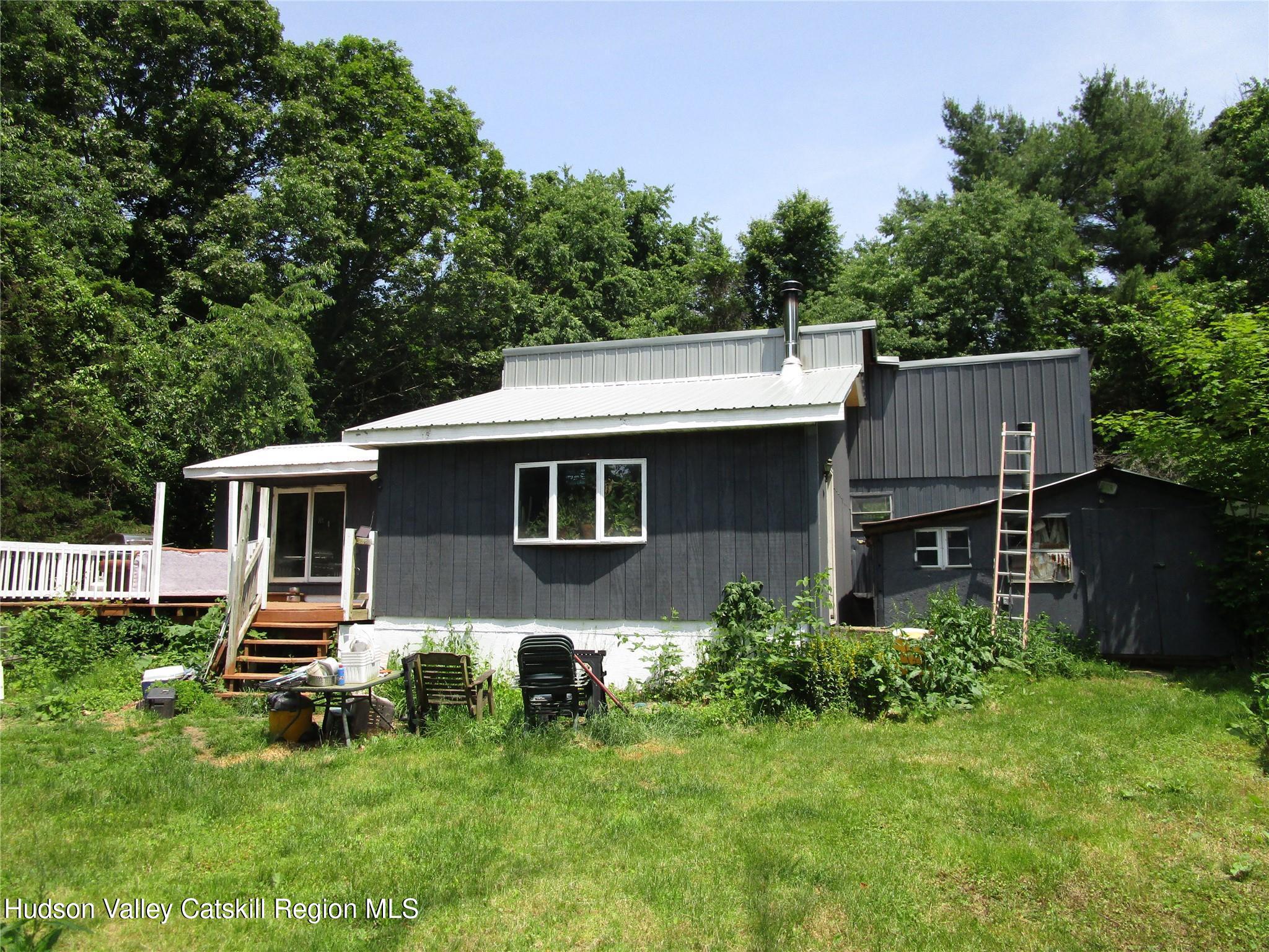 16 Field Road Hudson, NY 12534 - Photo 16 of 24 a front view of a house with garden