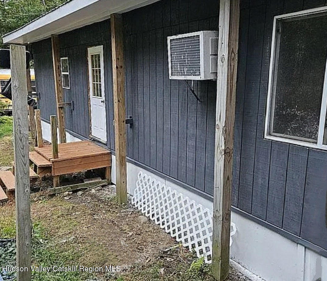 16 Field Road Greenville, NY 12083 - Photo 20 of 22 a backyard of a house with wooden floor