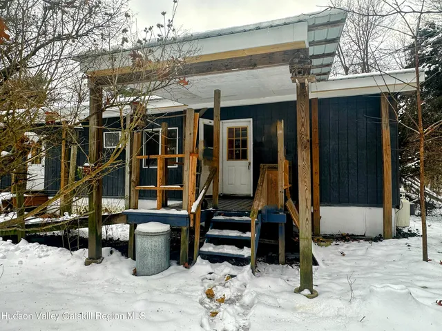 front view of a building with a bench