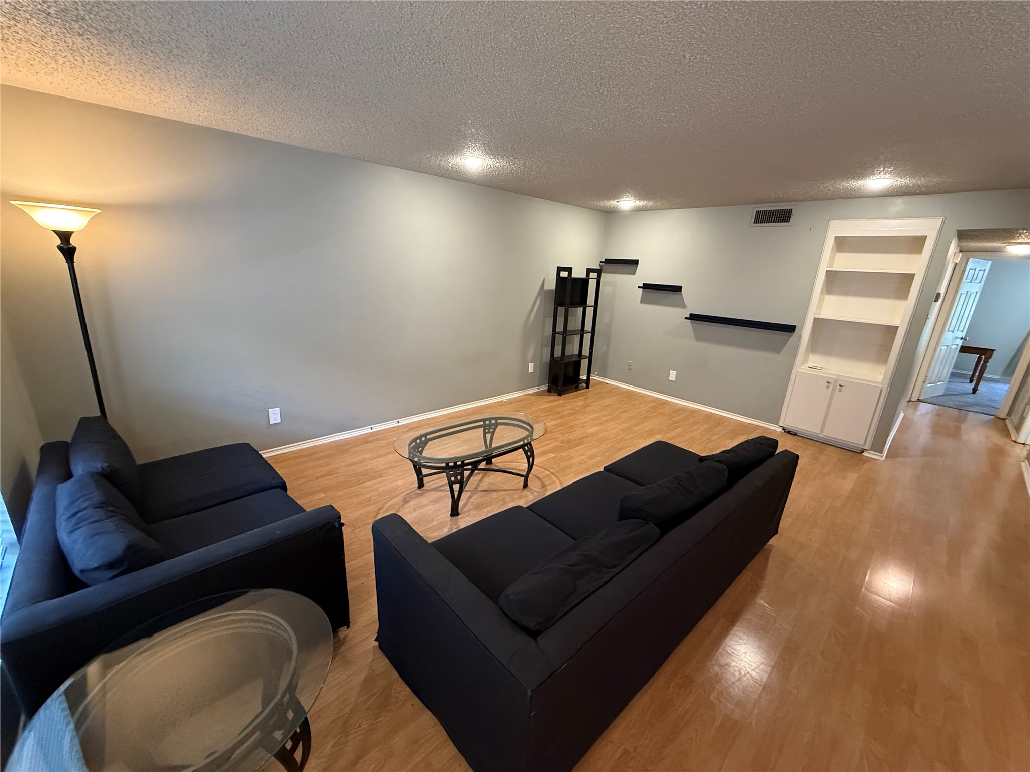 2401 Leon Street, Unit 209 Austin, TX 78705 - Photo 1 of 6 a living room with furniture