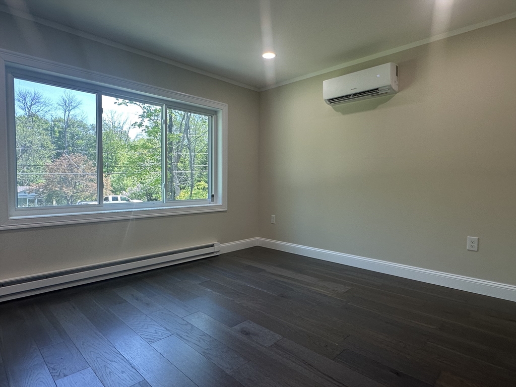 102 Wells Road Becket, MA 01223 - Photo 15 of 40 wooden floor in an empty room with a window