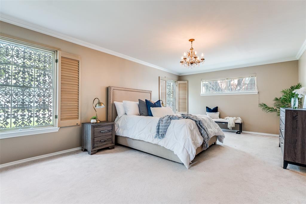 6070 Averill Way, Unit A Dallas, TX 75225 - Photo 15 of 26 a bedroom with bed and a window