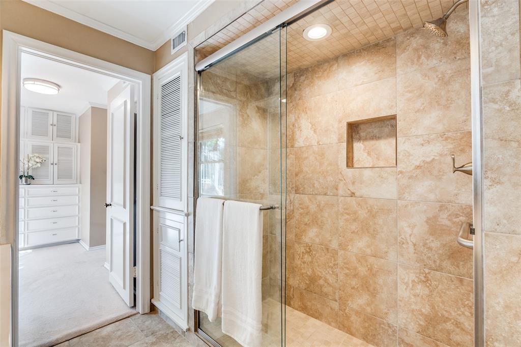 6070 Averill Way, Unit A Dallas, TX 75225 - Photo 20 of 26 a bathroom with a glass shower door
