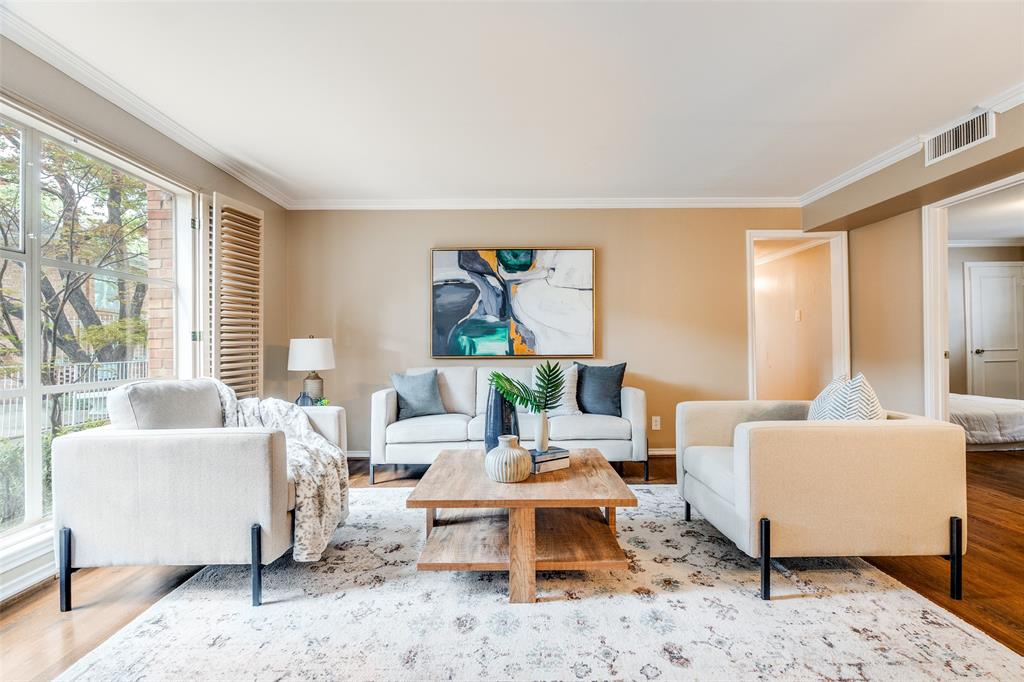 6070 Averill Way, Unit A Dallas, TX 75225 - Photo 2 of 26 a living room with furniture a rug a lamp and a large window