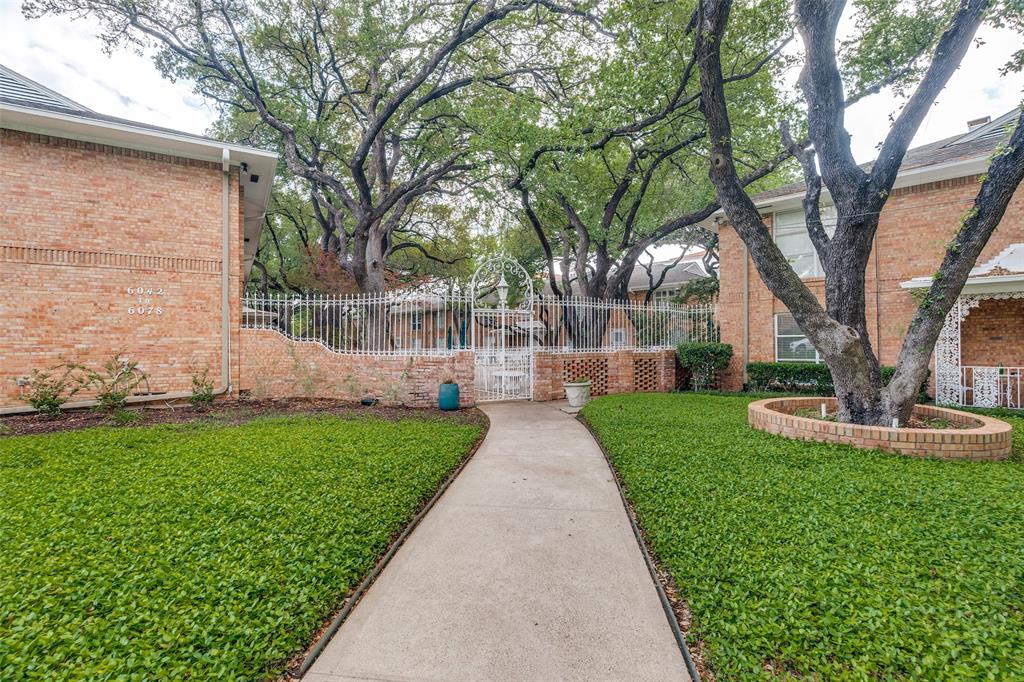 6070 Averill Way, Unit A Dallas, TX 75225 - Photo 25 of 26 a view of a backyard with large trees