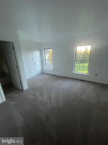 a view of a room that has a window in it