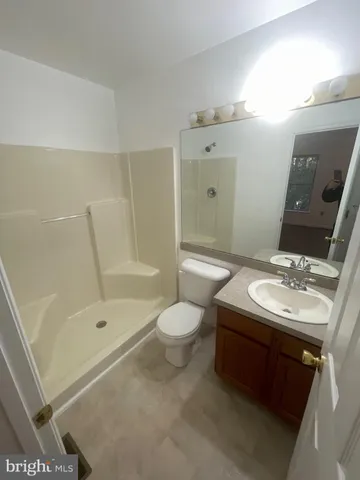a bathroom with a sink toilet tub and shower