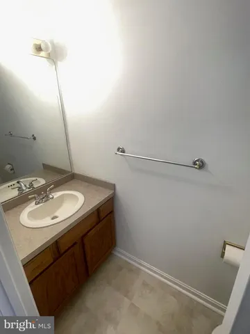 a bathroom with a sink and vanity