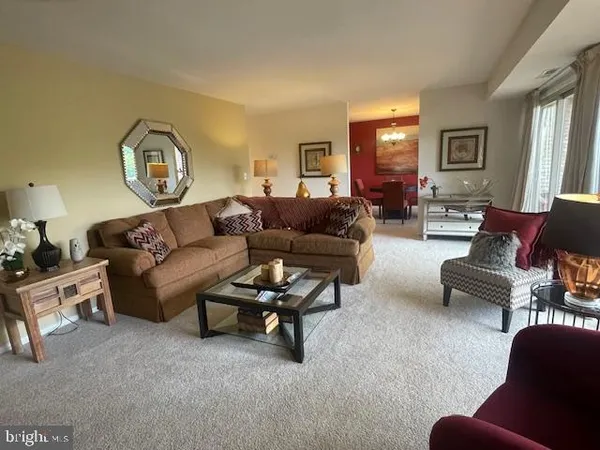 a spacious bedroom with two beds and large window