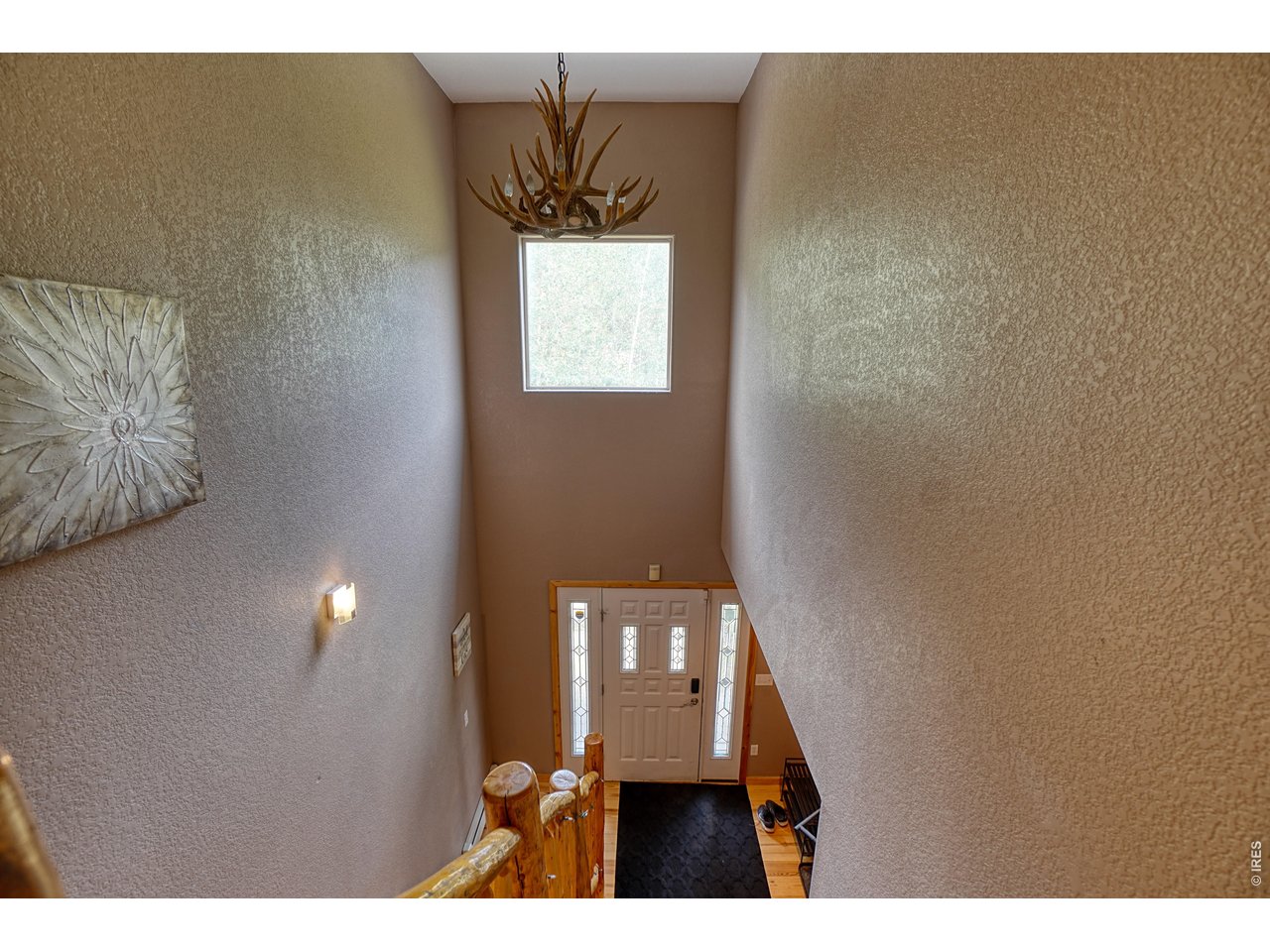 2353 Dory Hill Road Black Hawk, CO 80422 - Photo 38 of 50 Foyer - gorgeous pine staircase, excellent natural lighting