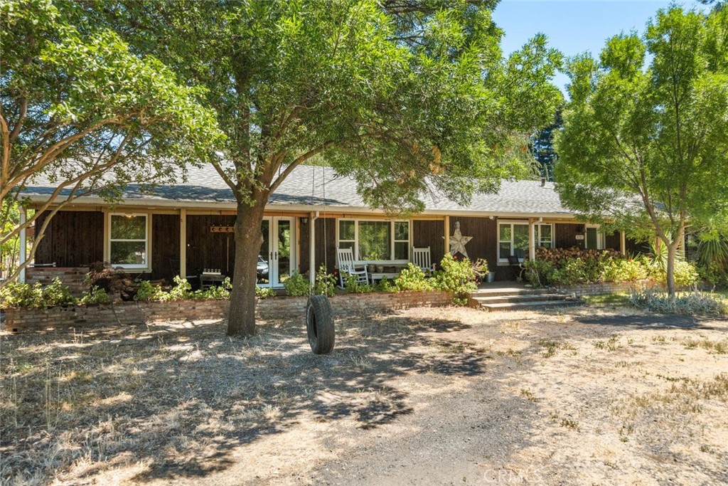 1727 Dayton Road Chico, CA 95928 - Photo 1 of 1 a front view of a house with a garden