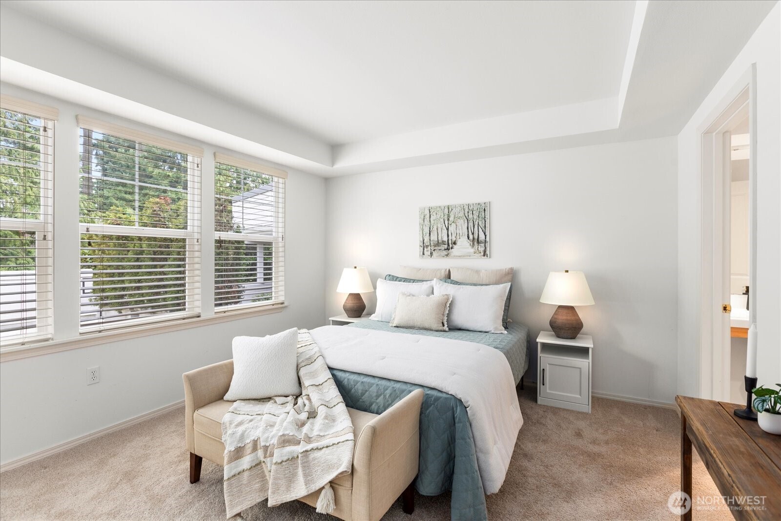 8500 Main Street, Unit F205 Edmonds, WA 98026 - Photo 12 of 30 a bedroom with a bed and a window