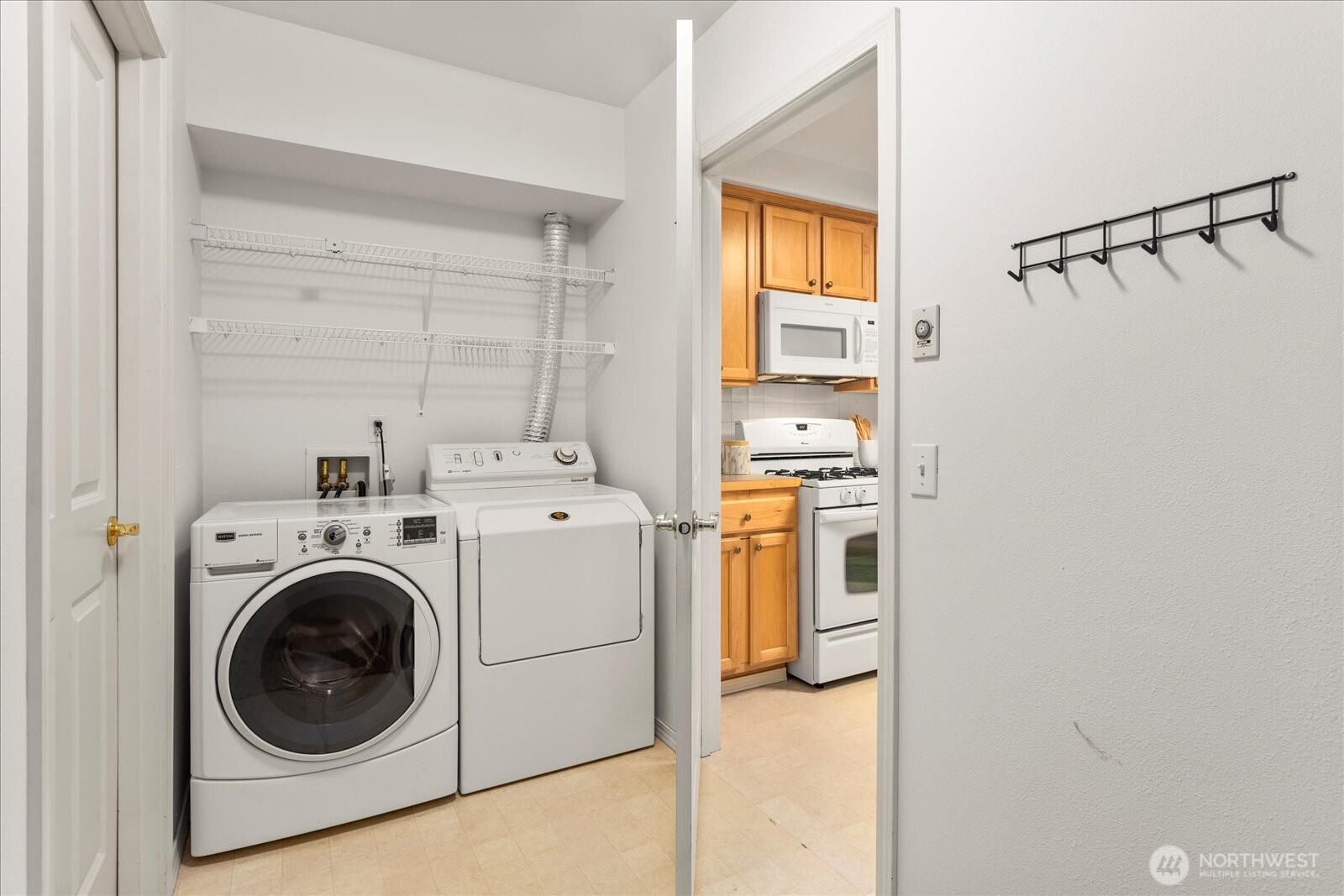 8500 Main Street, Unit F205 Edmonds, WA 98026 - Photo 19 of 30 a utility room with dryer and washer