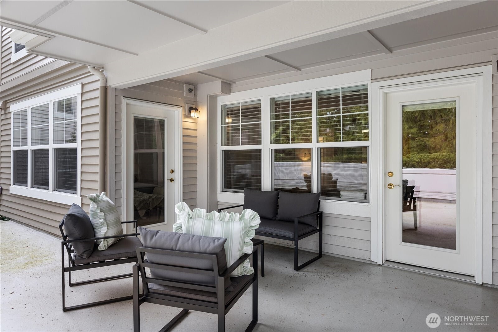 8500 Main Street, Unit F205 Edmonds, WA 98026 - Photo 22 of 30 a balcony with furniture and outdoor view