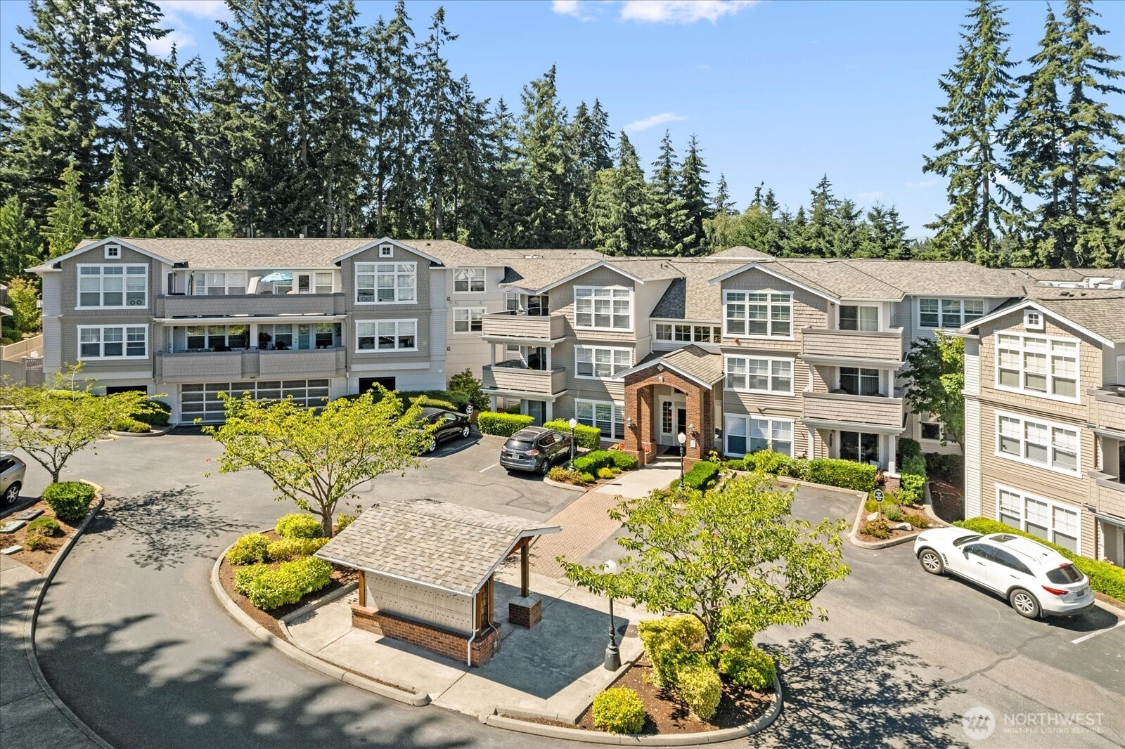 8500 Main Street, Unit F205 Edmonds, WA 98026 - Photo 25 of 30 a view of a swimming pool with a lounge chairs