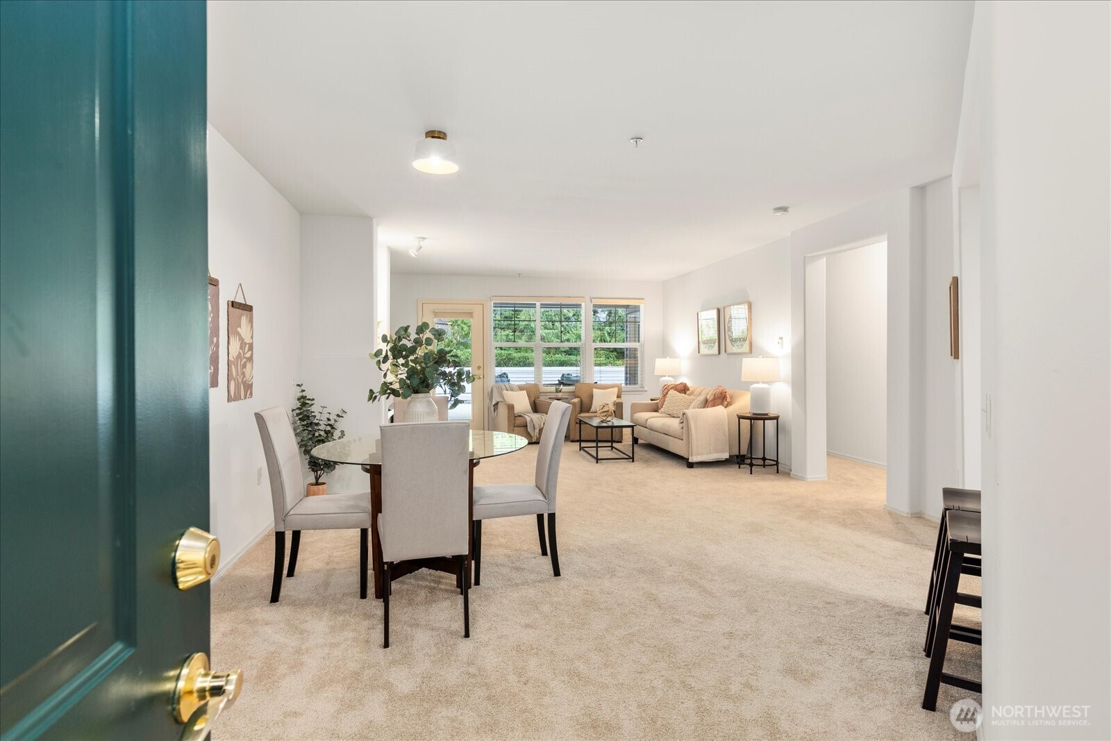 8500 Main Street, Unit F205 Edmonds, WA 98026 - Photo 5 of 30 a living room with furniture and a large window