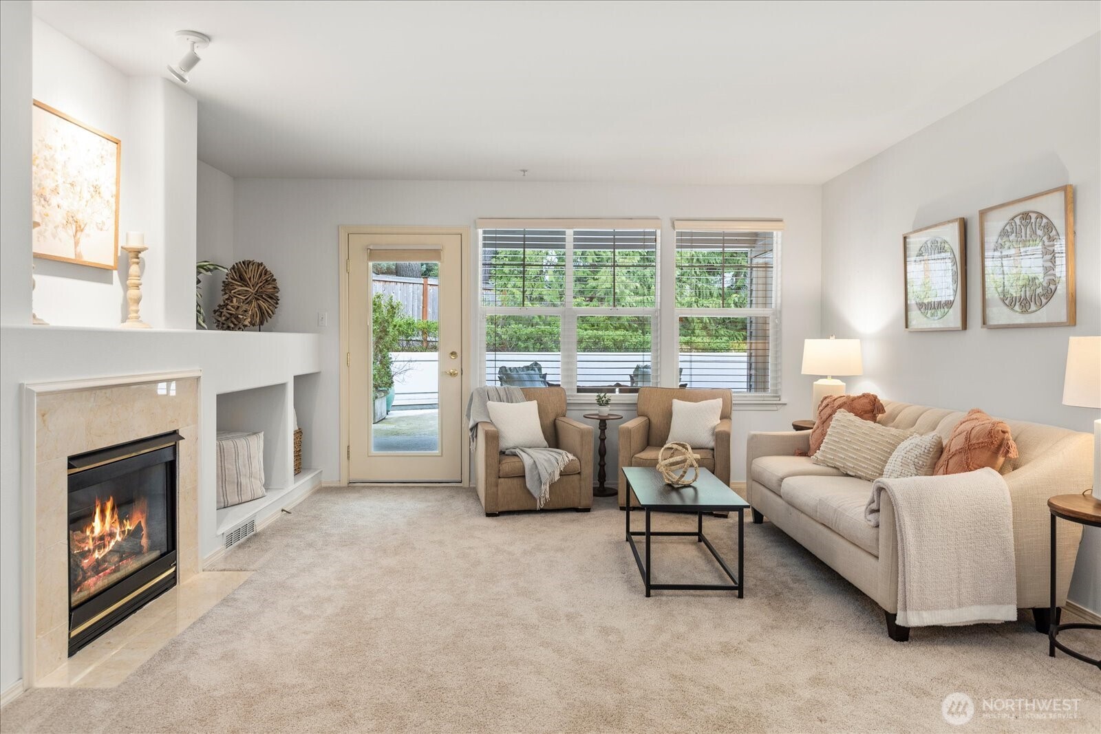 8500 Main Street, Unit F205 Edmonds, WA 98026 - Photo 6 of 30 a living room with furniture and a fireplace