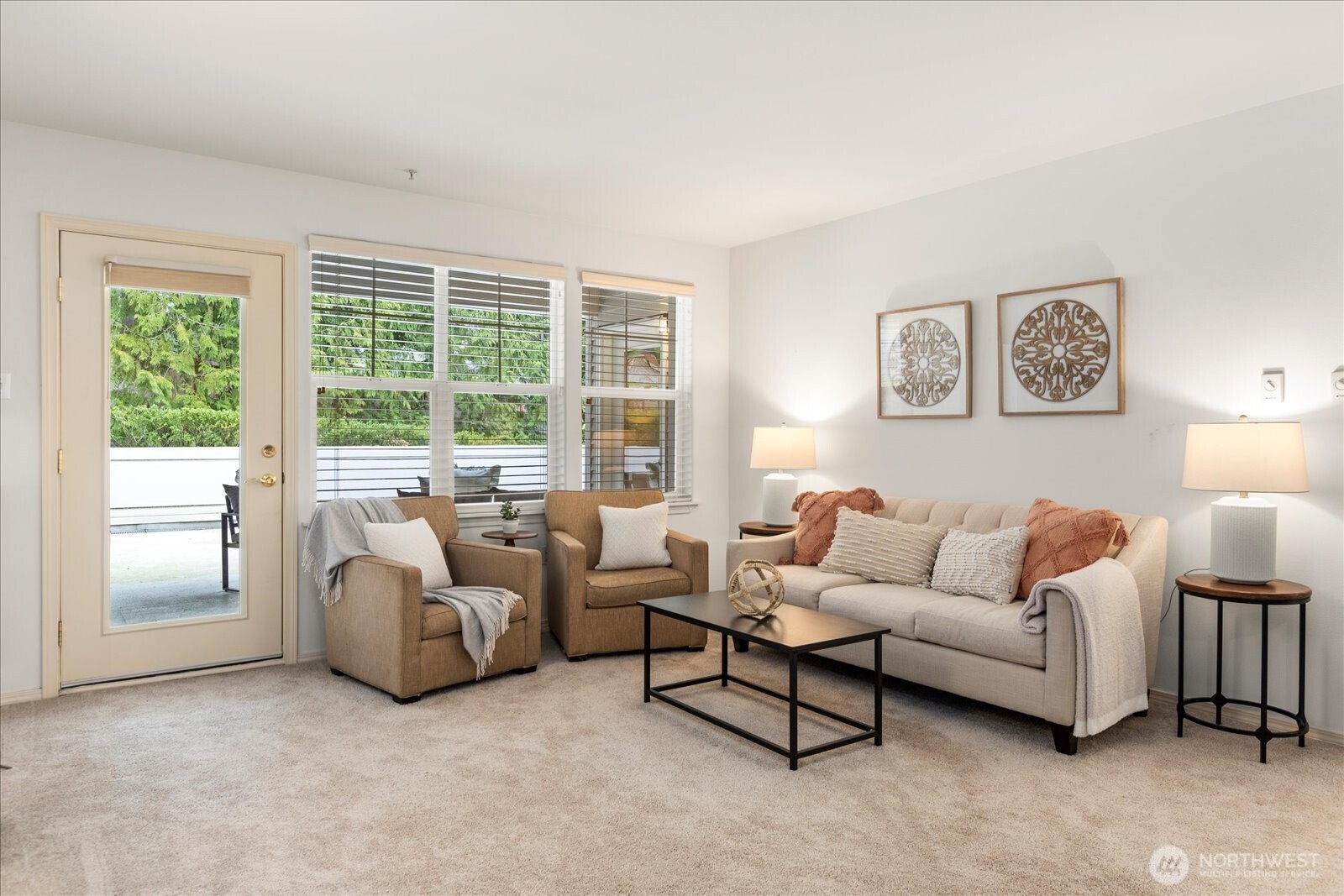8500 Main Street, Unit F205 Edmonds, WA 98026 - Photo 7 of 30 a living room with furniture and a large window