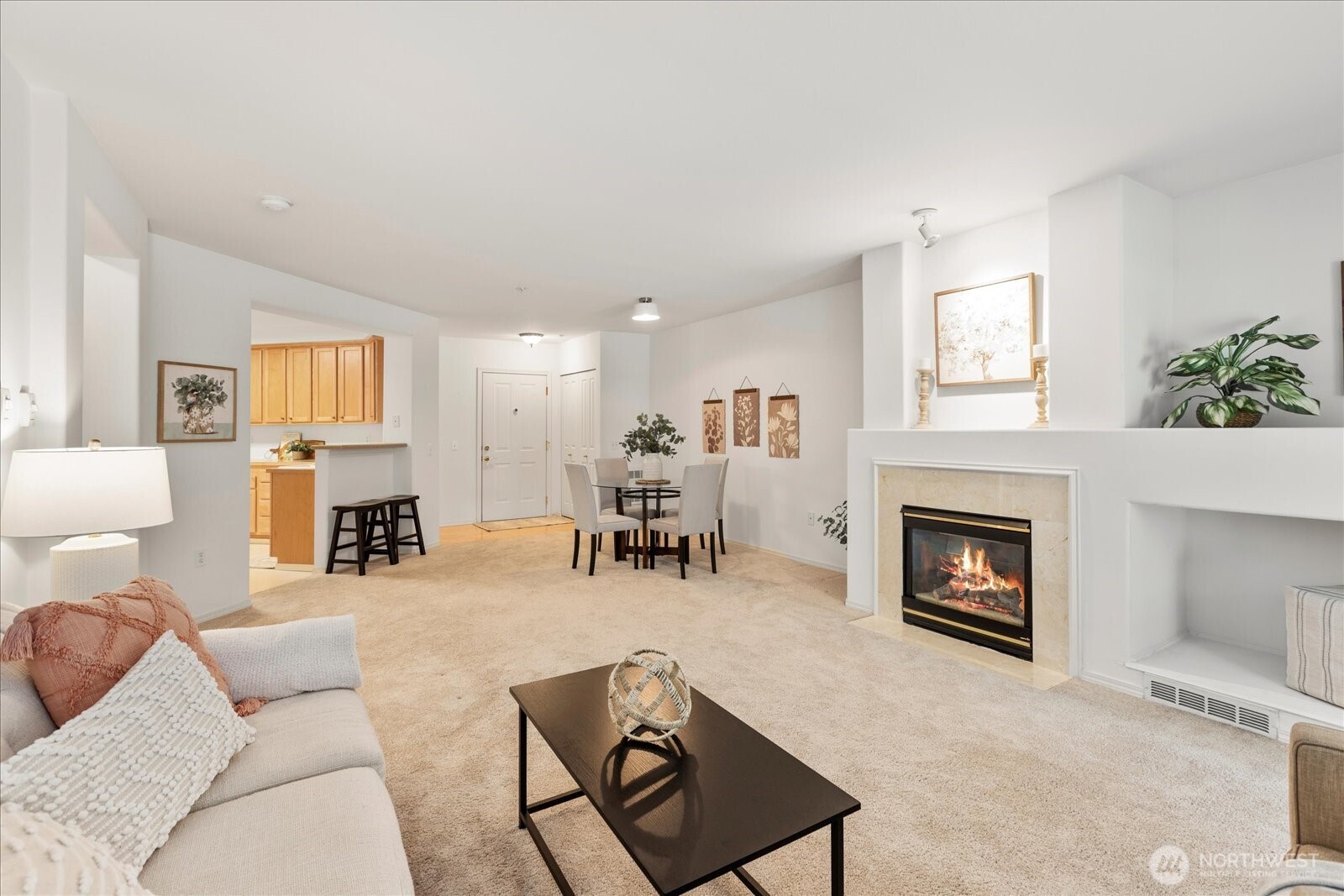 8500 Main Street, Unit F205 Edmonds, WA 98026 - Photo 8 of 30 a living room with furniture and a fireplace
