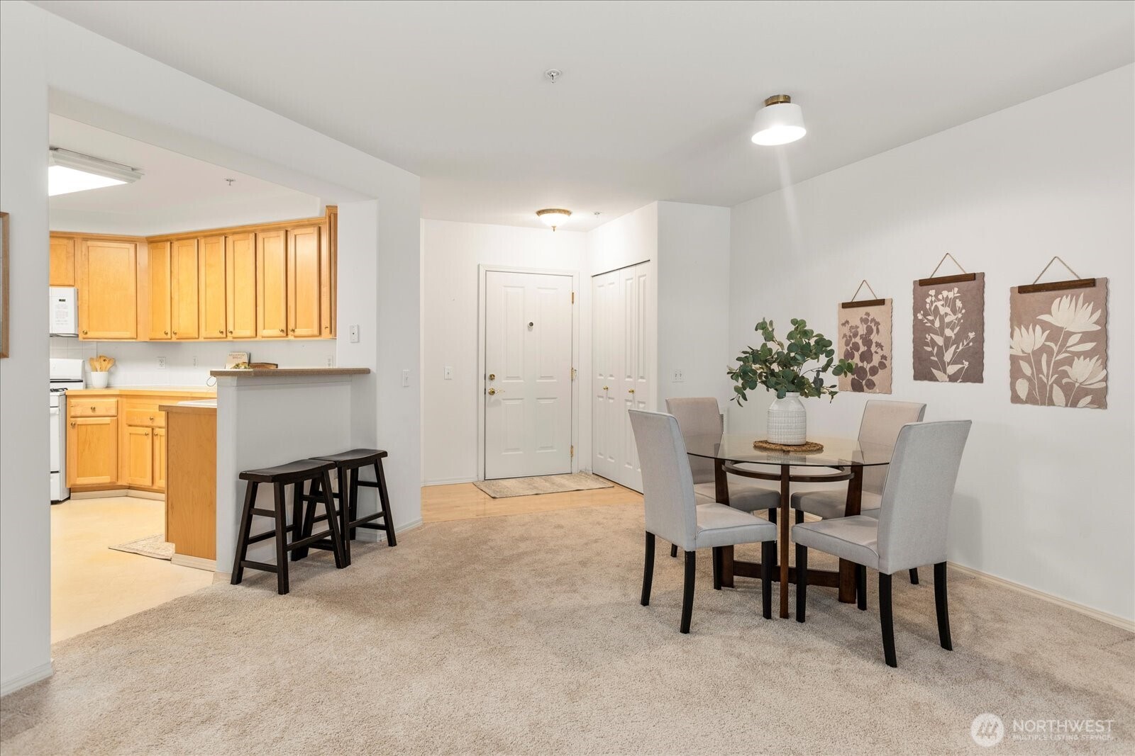 8500 Main Street, Unit F205 Edmonds, WA 98026 - Photo 9 of 30 a dining room with furniture and window