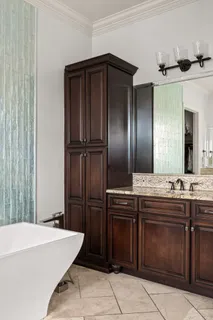 a kitchen with a refrigerator and a sink