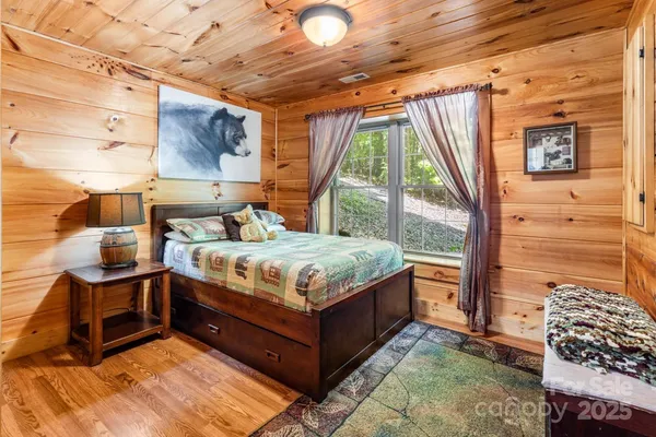 a bedroom with a bed and window