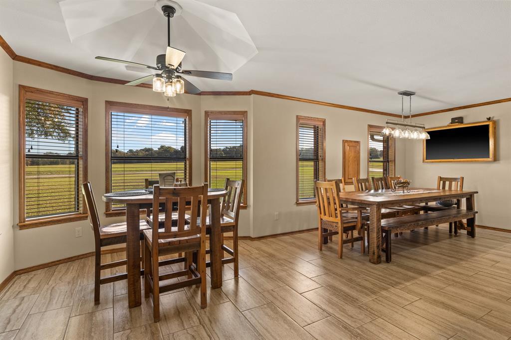 78 County Road 2137 Pittsburg, TX 75686 - Photo 11 of 40 a view of a dining room with furniture window and wooden floor
