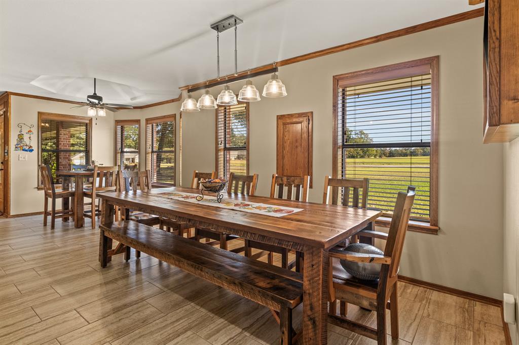 78 County Road 2137 Pittsburg, TX 75686 - Photo 18 of 40 a view of a dining room with furniture window and wooden floor