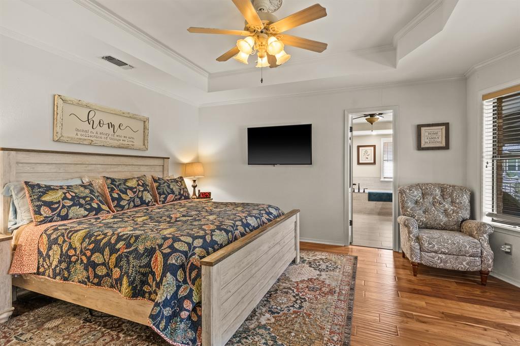 78 County Road 2137 Pittsburg, TX 75686 - Photo 21 of 40 a bed room with a bed window and a couch